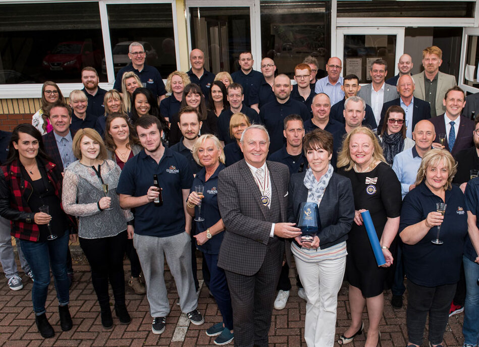 VALUES Glencairn staff photo, showing all the staff accepting the queens award